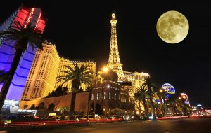 9548074 - a full moon over paris on the strip taken in las vegas, nevada, on march 16, 2011. composite.
